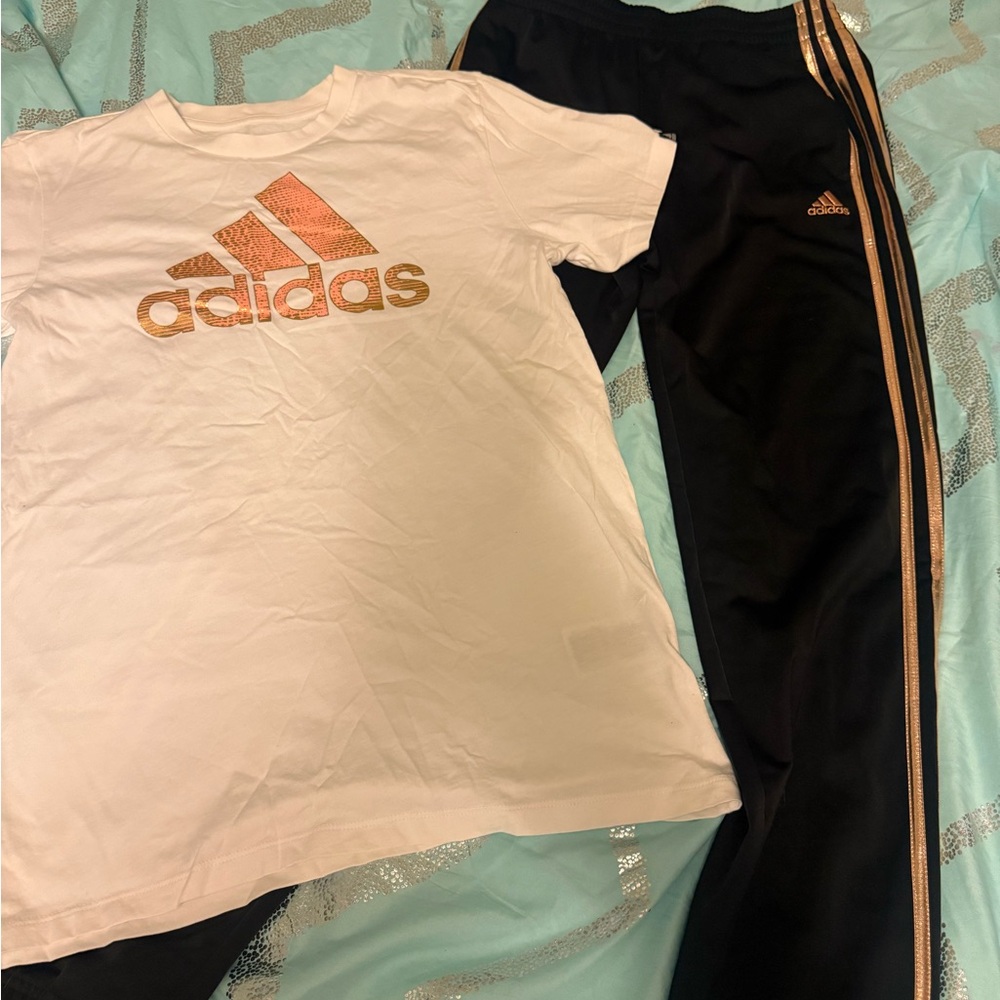 Adidas Kids Black Joggers with Gold Stripes, matching zip up sweatshirt and tee.